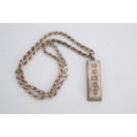 A 1977 silver ingot pendant and rope link neck chain, 42 g