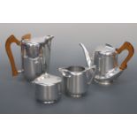 A four piece Piquot Ware tea set