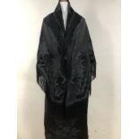 A Victorian black silk bustle skirt with applied jet-beaded decoration and a black velvet damask