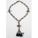 An early 20th Century geometric beadwork lariat necklace, 39 cm from top to tassel, (approximately