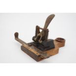 An early 20th Century office hole punch