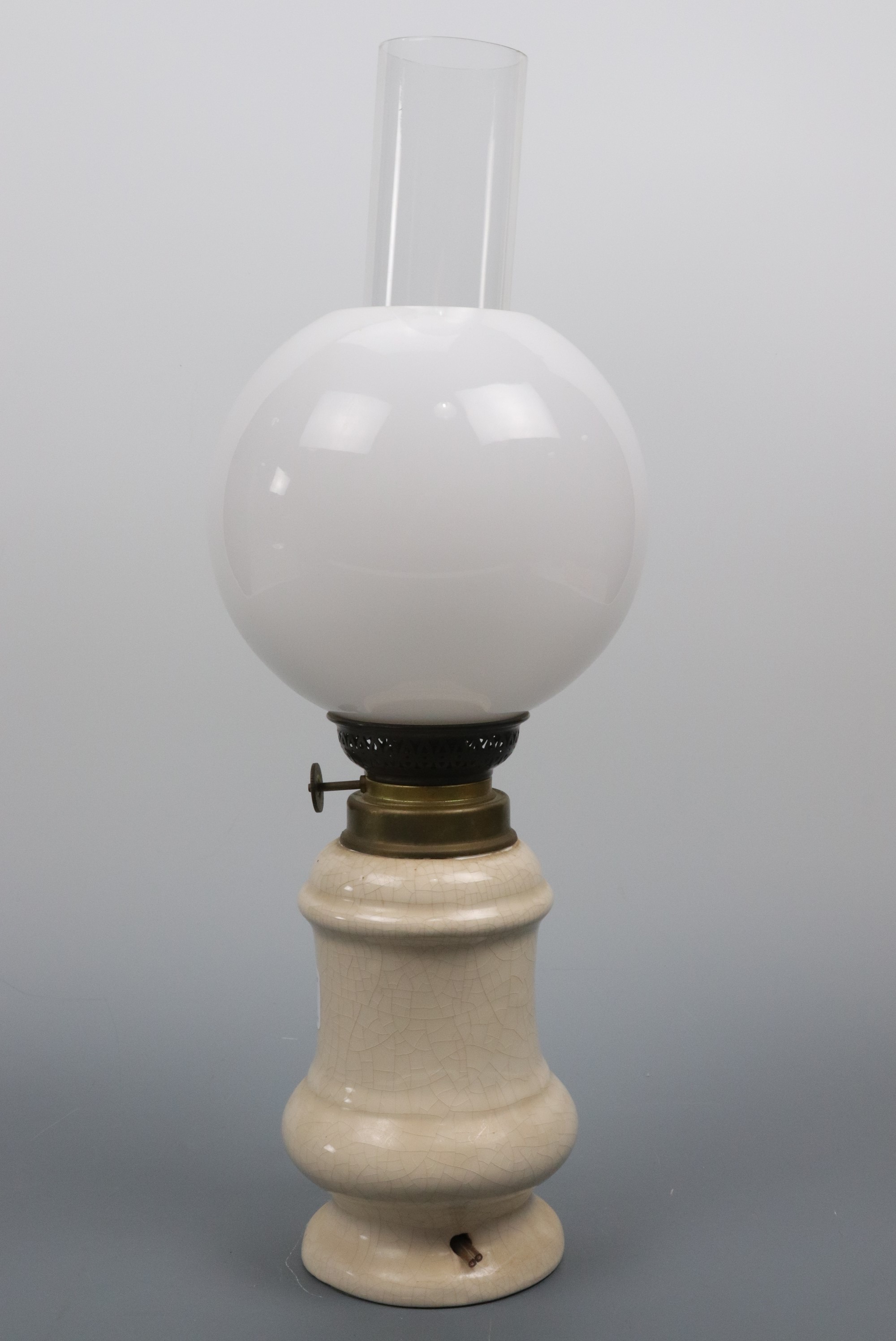 A modified oil lamp, 42 cm high
