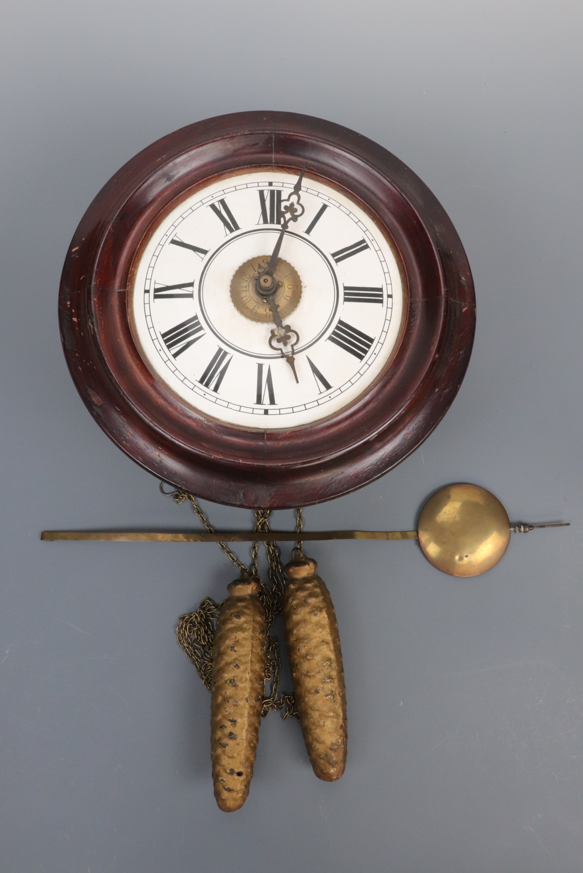 A late 19th Century dial alarm clock, with white enamelled face and Roman numerals, dial 28 cm (