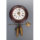 A late 19th Century dial alarm clock, with white enamelled face and Roman numerals, dial 28 cm (