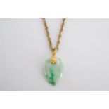 A heart-shaped jade pendant on a 9 ct gold rope link neck chain, chain 9 g