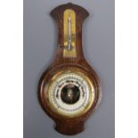 An oak barometer / thermometer, 35 cm high