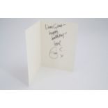 An autograph greetings card from Eric Clapton to a member of his management