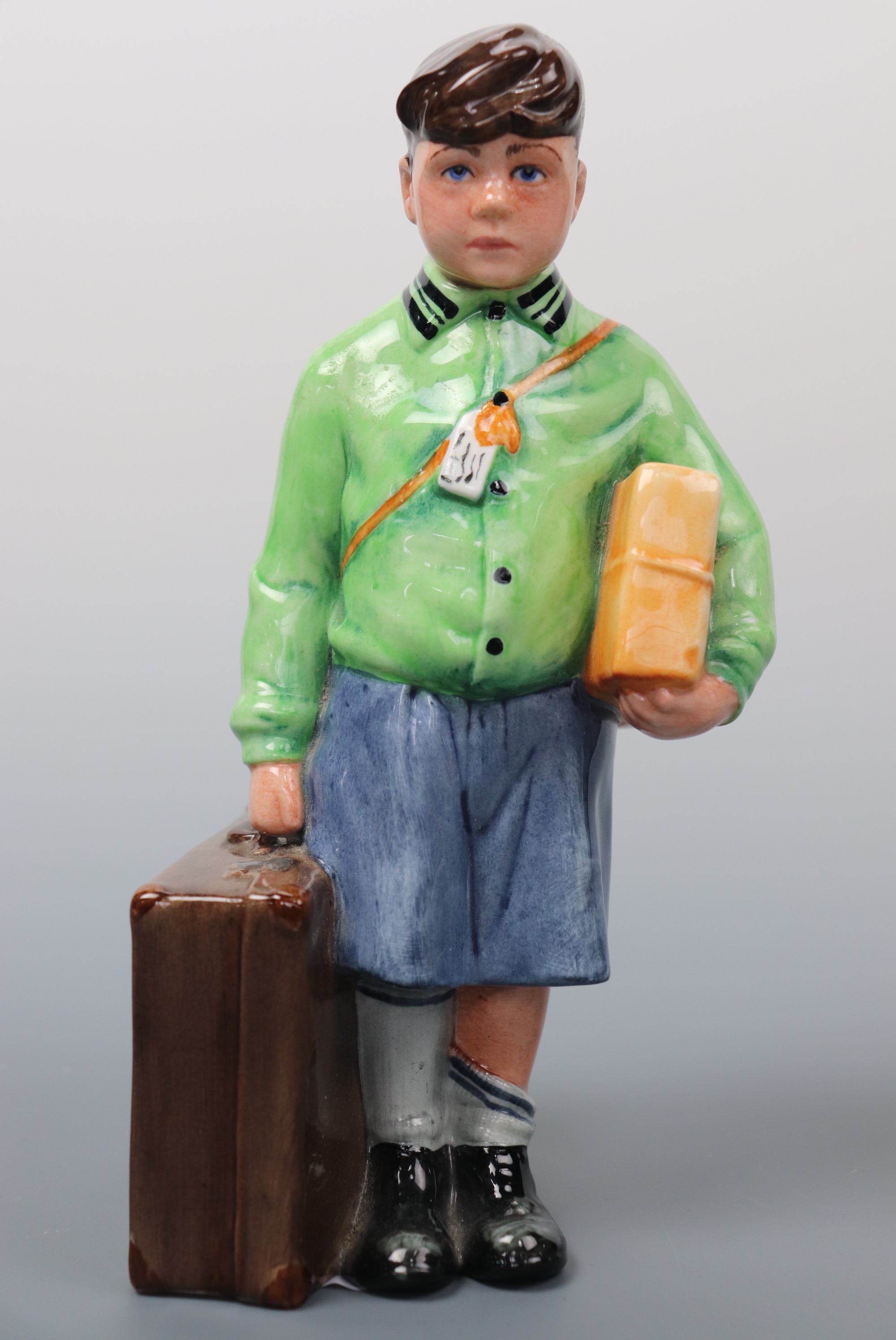 A Royal Doulton figurine The Boy Evacuee, HN3202