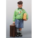 A Royal Doulton figurine The Boy Evacuee, HN3202