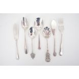A silver butter knife and preserve spoon pair together with sundry other silver spoons, a butter