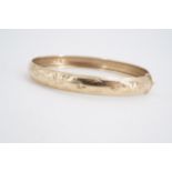 A 9 ct gold hinged bangle, 5.9 g