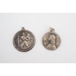 An early 20th Century French Jeanne d'Arc medallion together with a white metal St Christopher