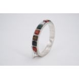 A Victorian polished hardstone and white metal hinged bangle, 6 cm x 5.5 cm