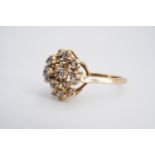 A pale blue spinel open terraced cluster ring, the stones set on a 9 ct gold shank, P/Q