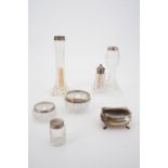 A silver salt cellar and various silver-mounted glass bud vases, cruets etc