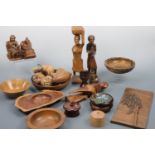A large quantity of wooden objects including trays, plaques, Victorian door finger plates, figures
