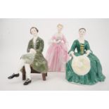 Three Royal Doulton figurines; A Gentleman, A Lady from of Williamsburg and A Hostess from