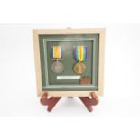 Framed British War and Victory medals together with a fob medallion to 2-167000 Pte Sydney Ford,