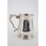 A George II silver baluster tankard, sponsor's mark part struck, likely Thomas Tearle, London, 1736,