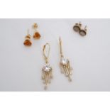 Three sets of yellow metal earrings, including a pair of claw-set citrine coloured studs, 5.3 g