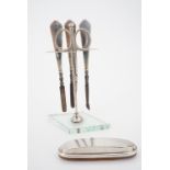 A 1920s silver-mounted manicure set together with a nail buff, marks rubbed, 15 cm high