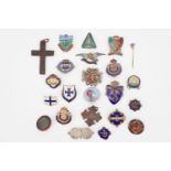 A large quantity of enamel lapel badges together with a Bakelite crucifix