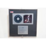 A framed BPI platinum CD disc Certified Sales Award to Eric Clapton to recognise UK sales of more