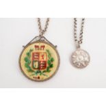 A white metal mounted, enameled and gilt 1845 crown coin pendant necklace together with a Queen