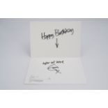 An autograph greetings card from Eric Clapton to a member of his management