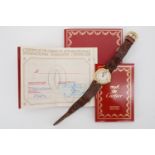A 1990s lady's Must de Cartier silver-gilt quartz wrist watch, a gift from Eric Clapton to a