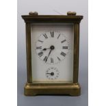 A late 19th / early 20th Century carriage alarm clock, 10.5 cm excluding handle, (a/f)