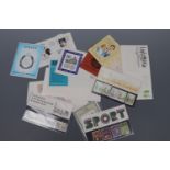 A small quantity of first day covers, mint decimal stamp packs etc