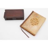 A 19th Century treen book-form box together with a Red Letter New Testament having boards of