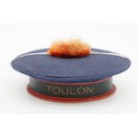 A vintage novelty cosmetics or confectionary box in the form of a French navy cap bearing a Toulon