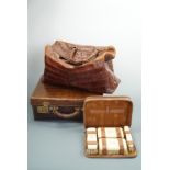 A vintage crocodile suitcase, 41 x 32 x 16 cm, together with a gent's cased brush set and a