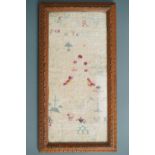 An antique needlework motif / band sampler, framed under glass, 40 x 21 cm (a/f)