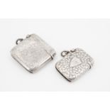 A small late Victorian silver fob Vesta case, engraved in a dense foliate pattern around a shield