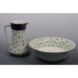 A Wedgwood wash ewer and basin, transfer-printed and hand-tinted with floral sprigs, edged with a