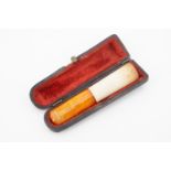 A late 19th Century meerschaum and amber cheroot or cigar holder