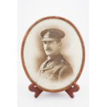 A framed portrait photograph of a Border Regiment officer, 32 cm x 27 cm