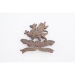 An 11th (Lonsdale) Battalion Officer's Service Dress cap badge