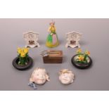 A group of novelty ceramics including Goss daffodils, an Arcadian China Miss Holland,