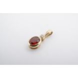 A garnet, diamond and yellow metal pendant, 14 mm, 0.4 g