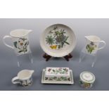 Six items of Portmerion pottery including three jugs, a butter dish, flan dish etc.