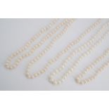 Four princess length single strand necklaces of cultured freshwater pearls, 40 cm, pearls each