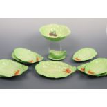 A Carlton Ware salad service for eight, comprising salad bowl, dishes and dressing jug with stand