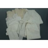 Antique handmade children's under-garments, ladies' aprons and a quantity of lace trimmings,