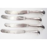 Four Georgian silver-pistol-handled dinner knives, the handles bearing engraved armorial crests,