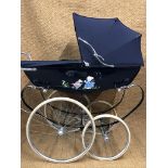 A 1970s Silver Cross pram with hand-painted decorative coachwork in near-new condition, originally