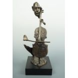 A contemporary bronzed sculpture of a cellist, on an ebonized platform base, 42 cm